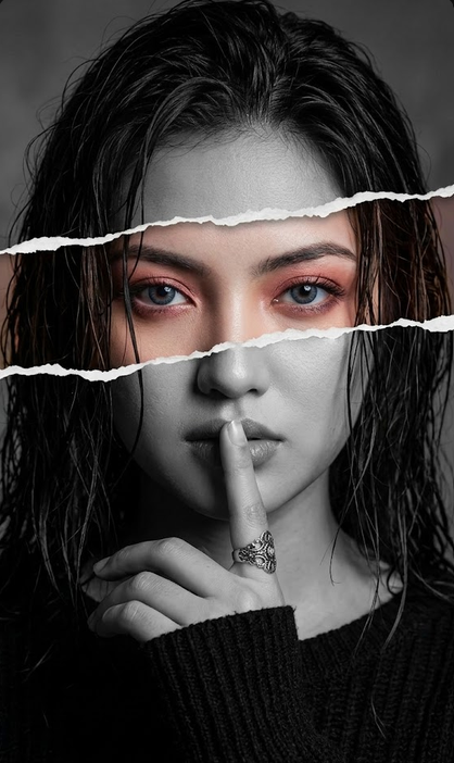 The image features a selective color effect where only the warm pinkish eyeshadow and eye area are in full color